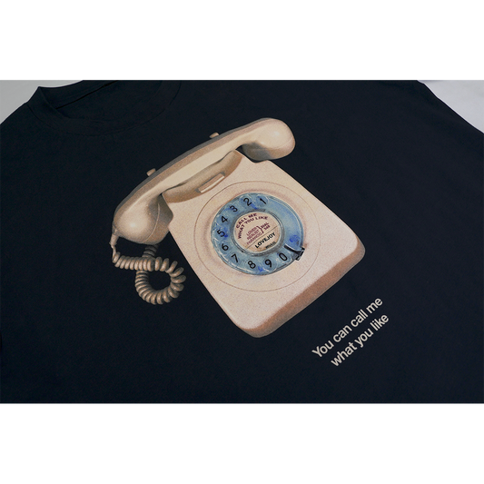 Close-up view of the front T-shirt print featuring a retro telephone photo with the text “You can call me what you like” printed underneath.