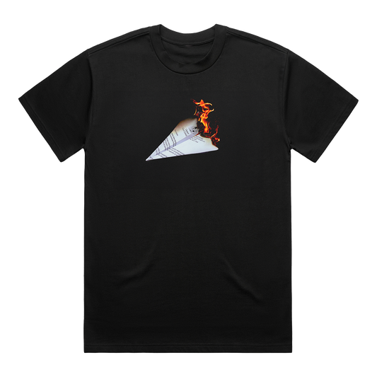 Front view of a black unisex regular fit T-shirt featuring a burning paper plane graphic printed across the chest.