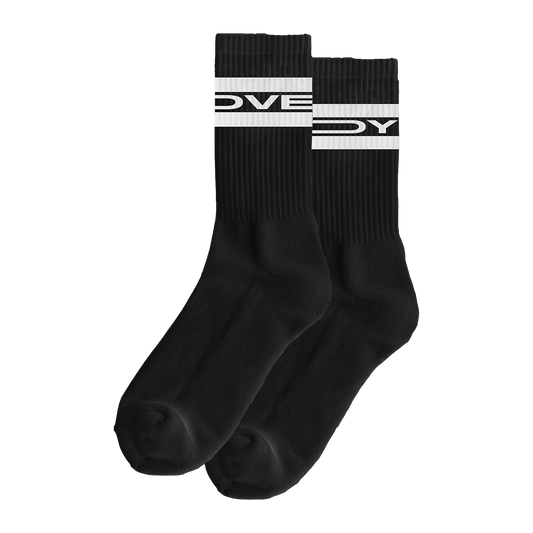 Front view of a pair of long black socks with white “Lovejoy” text printed around the upper cuff area.