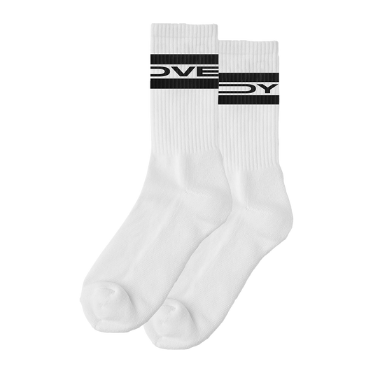 Front view of a pair of long white socks with black “Lovejoy” text printed around the upper cuff area.