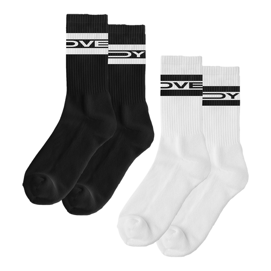 Front view of a pair of black socks and a pair of white socks. The white socks feature black “Lovejoy” text printed at the top, while the black socks have white “Lovejoy” text printed at the top.